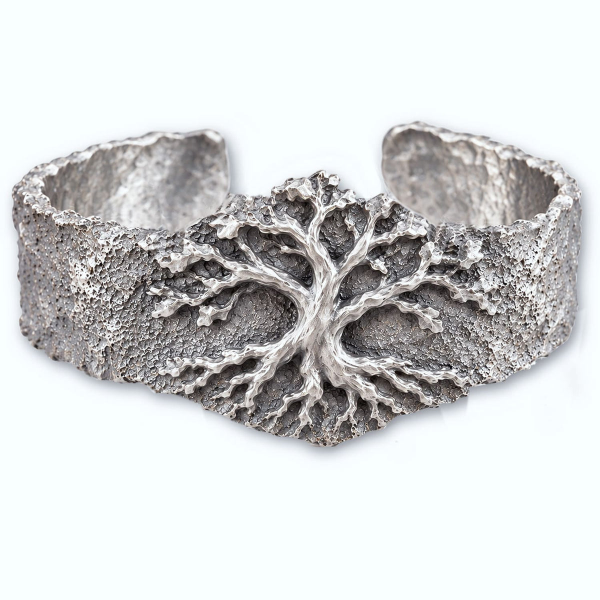 This Yggdrasil is a crater moon dust textured cuff bangle with a centre tree of life, a heavy bracelet in solid silver 