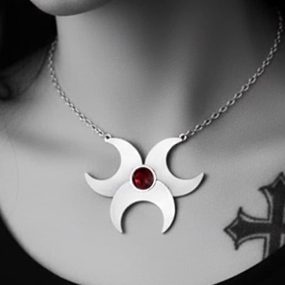 Solid silver triple moon pagan necklace featuring a deep bohemian red garnet teardrop gemstone, handcrafted in the UK by SilverfireUK
