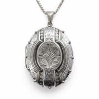 Victorian gothic style large sterling silver locket with intricate oxidised patterning and silver rivet studs
