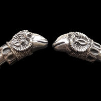 handmade solid silver ram's heads from end of solid silver torque bangle based on an historical archeology  find 
