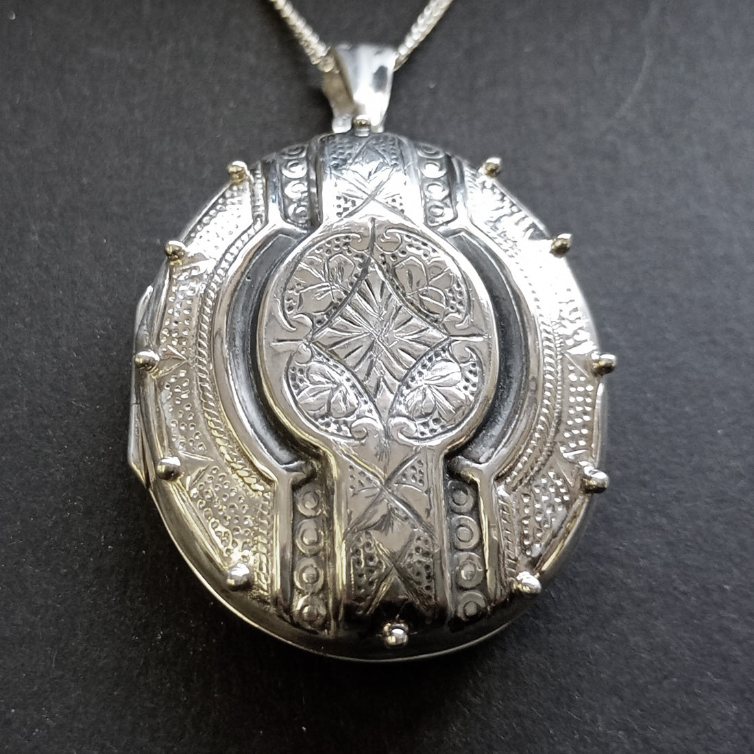 close-up of large oval gothic victorian locket 