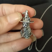 salem witches cat pendant handmade  in  solid silver held in hand