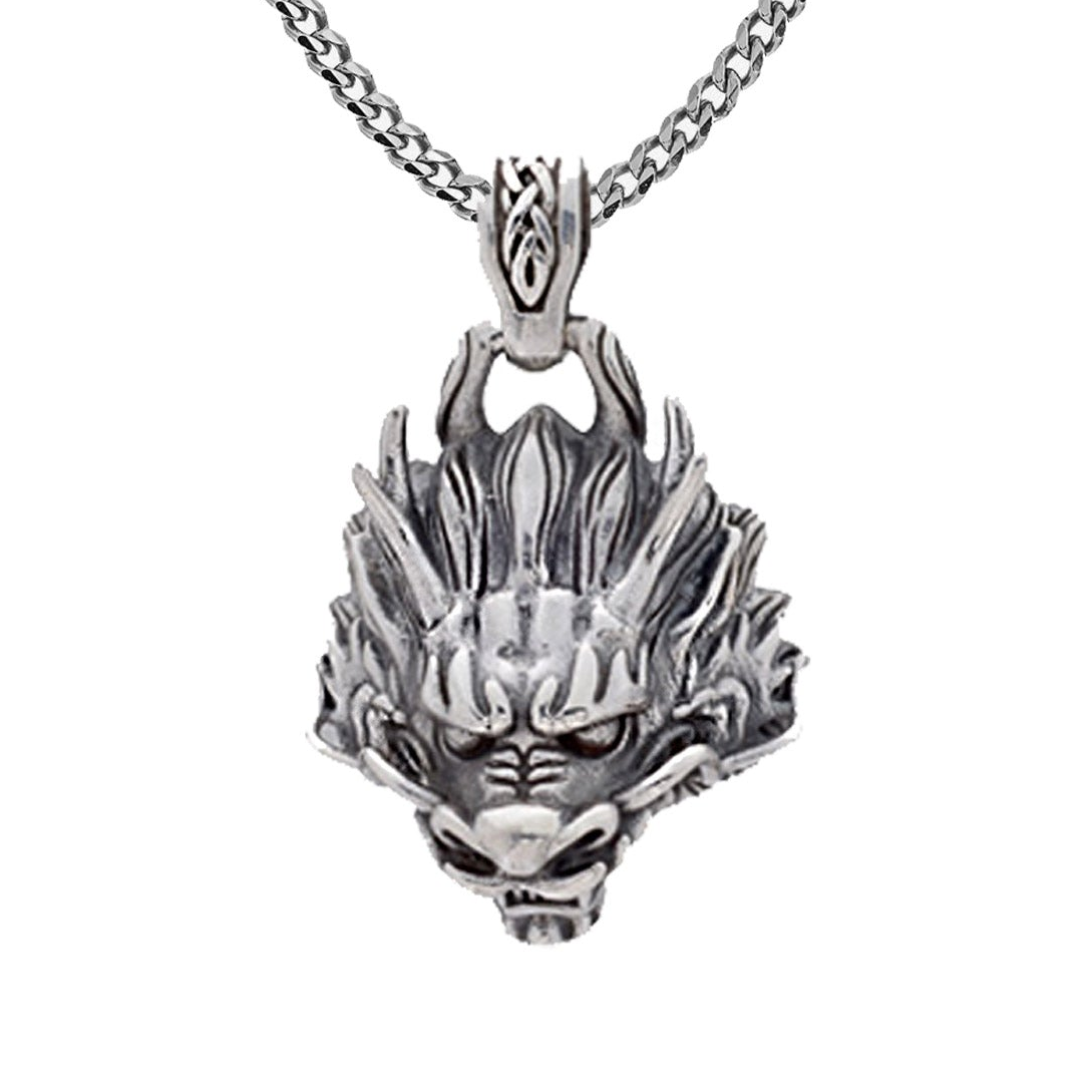 Mens Silver dragon head pendant on a chain against a white background