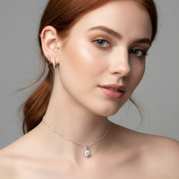 woman wearing silver choker necklace with crystal 