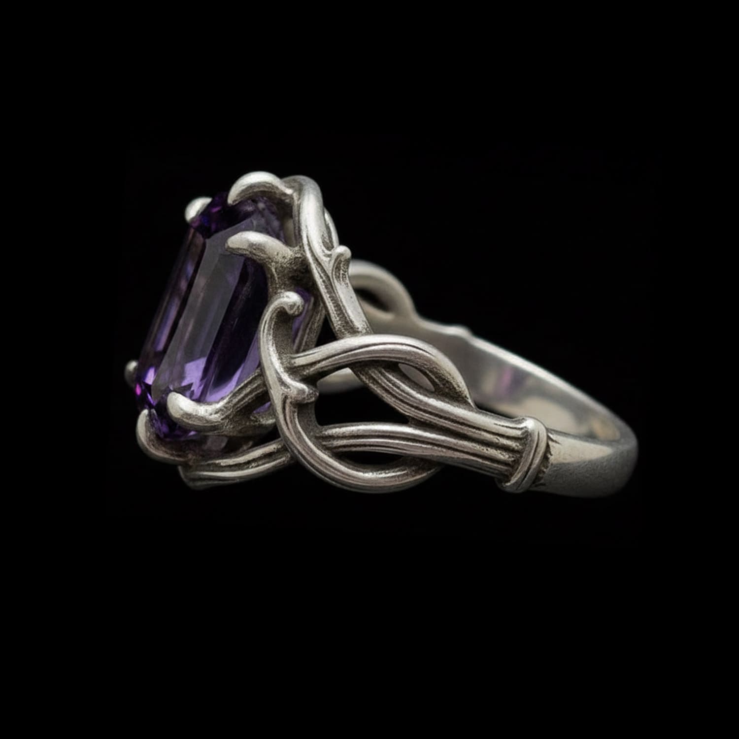 a striking gothic engagement ring 'the thorns of devotion' in sterling silver with  a dark amethyst stone