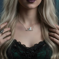 unusual silver bee necklace on a witchy model 