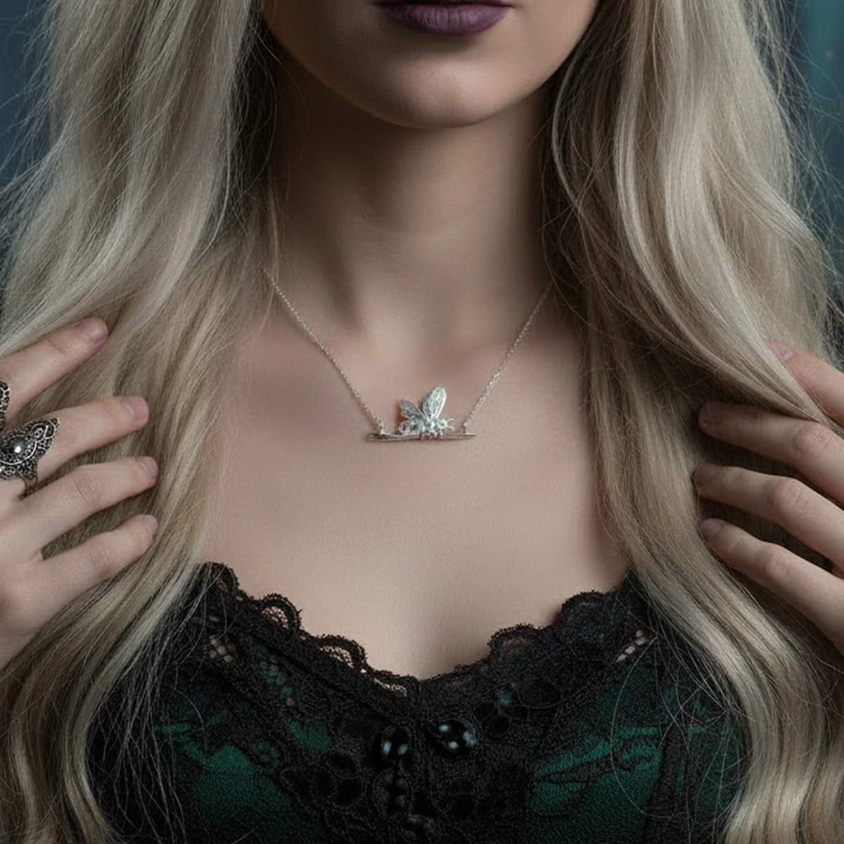 unusual silver bee necklace on a witchy model 