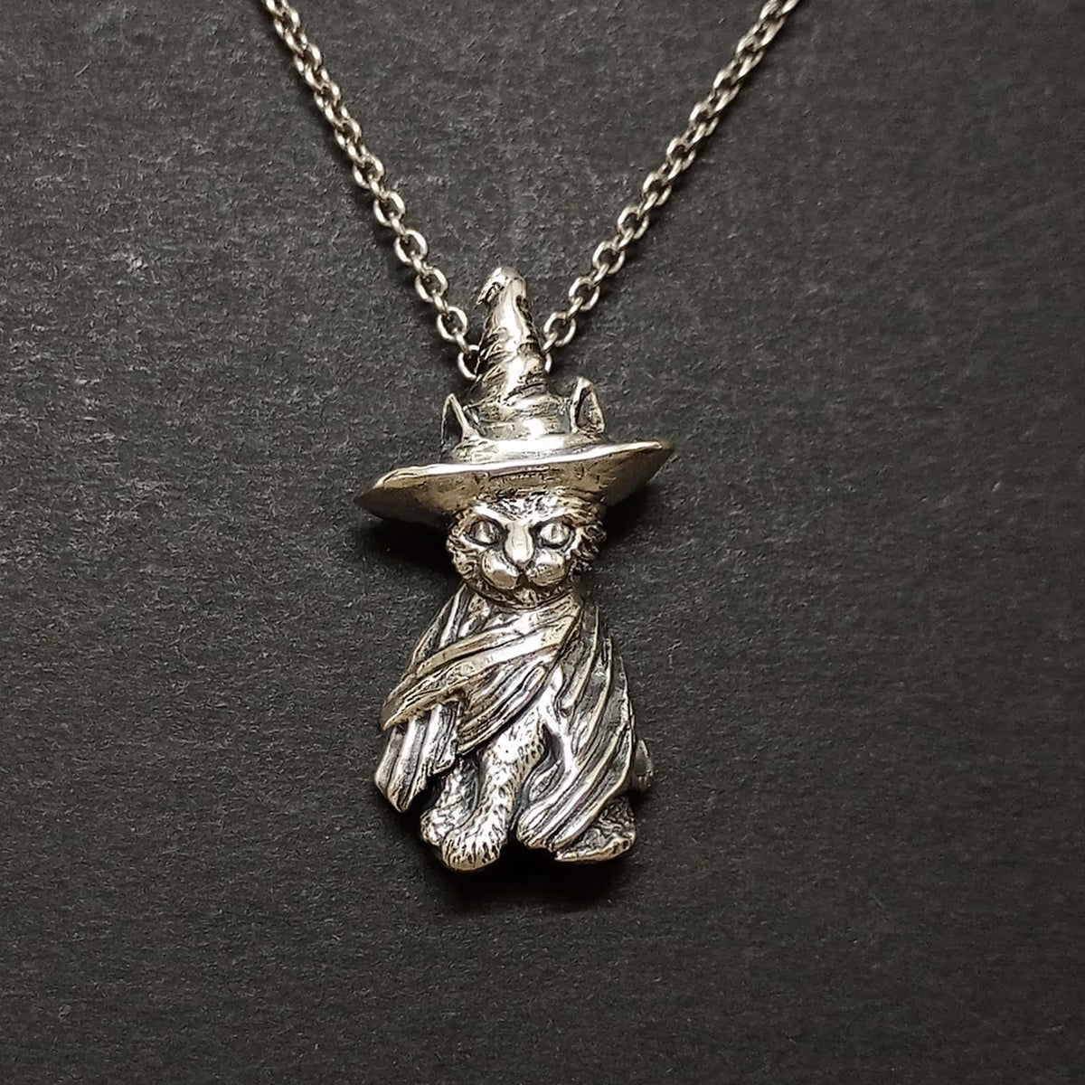handmade solid silver witchy cat pendant on dark oxidised chain, gothic pagan style
