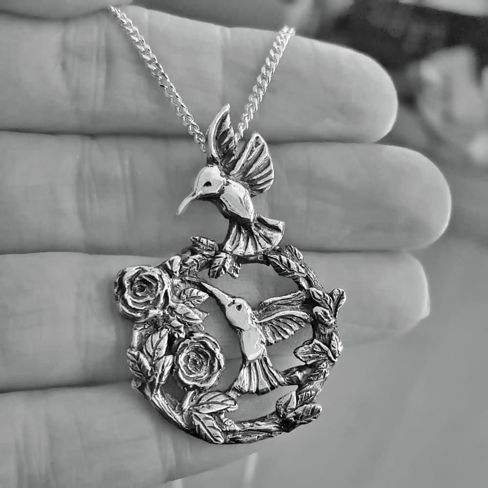 silver hummingbird necklace with roses 